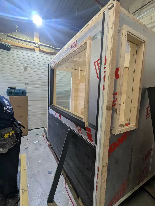 Adding a window and Chamclad to a sauna wall panel in the shop