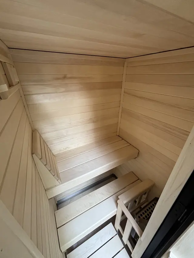 Aspen interior with an L-shaped bench and railing