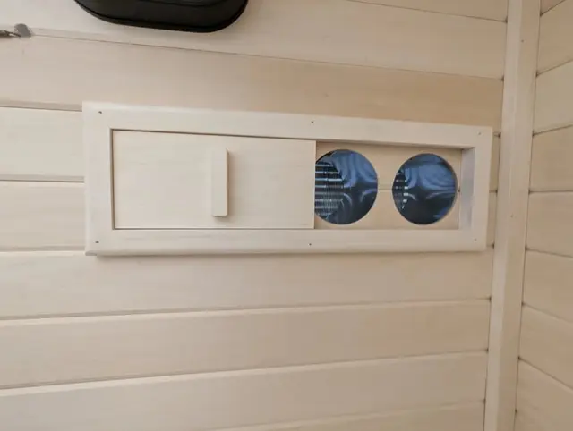 Adjustable vent in an aspen wall