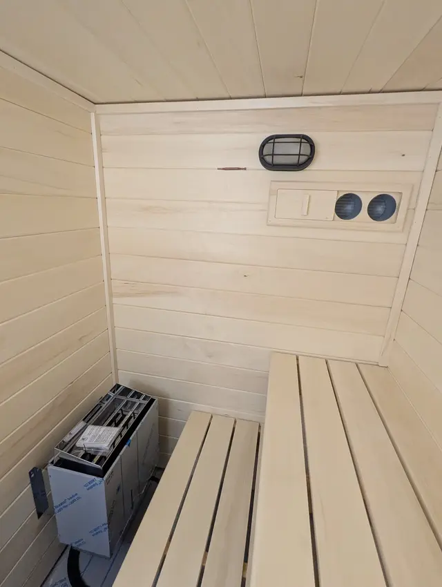Aspen interior with a heater, bench, light and vents