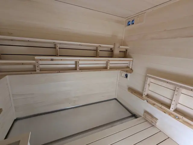Aspen benches and backrests inside a sauna