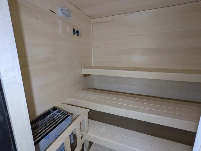 Aspen interior with two benches and a heater