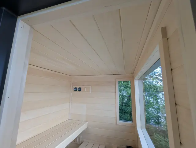 Aspen interior with a bench and two windows