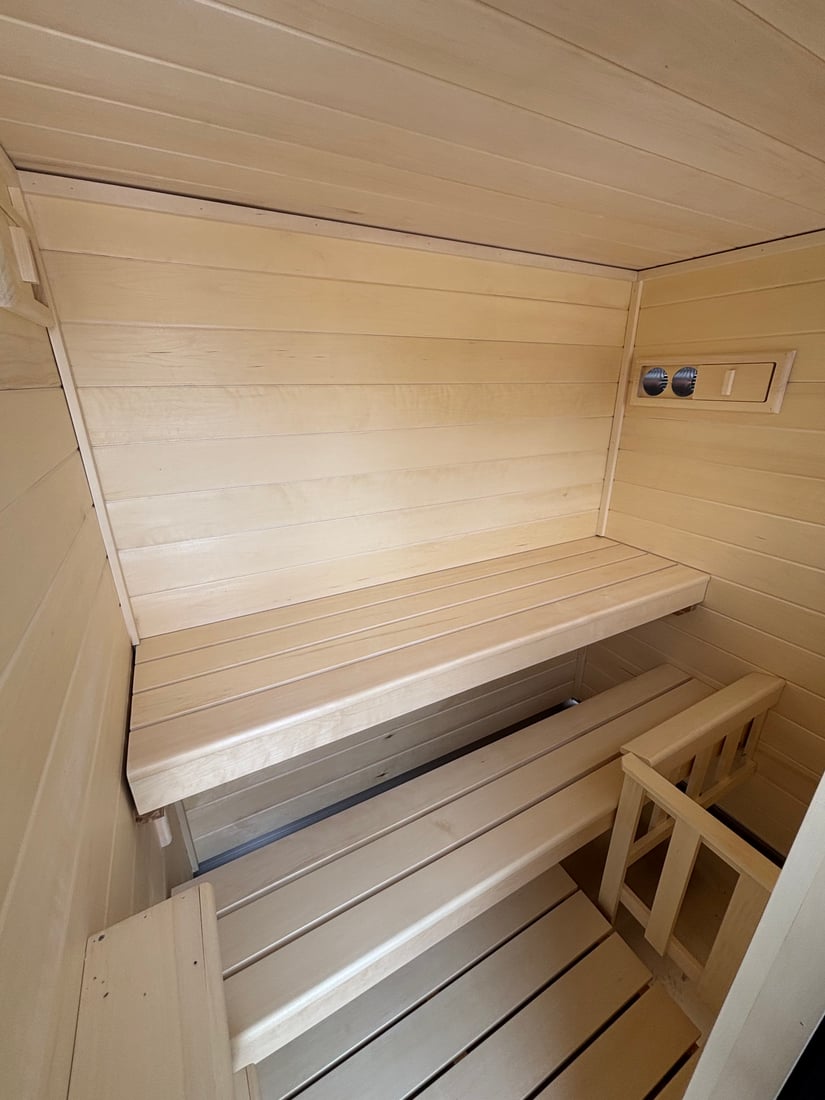 Aspen wood ceiling and walls inside a finished Ryt Sauna
