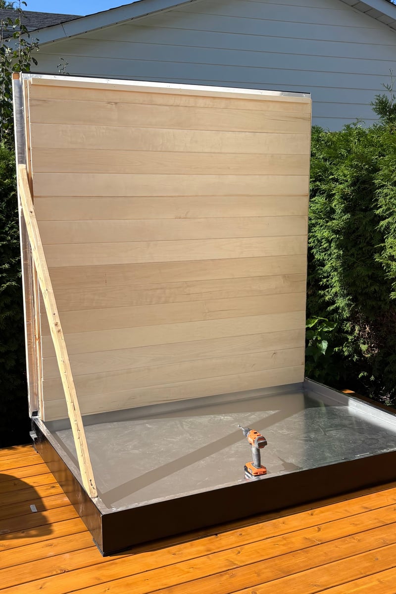 A Ryt Sauna rear wall installed on its base during assembly